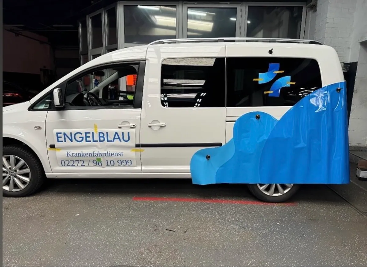 Wrap being applied to the VW Caddy